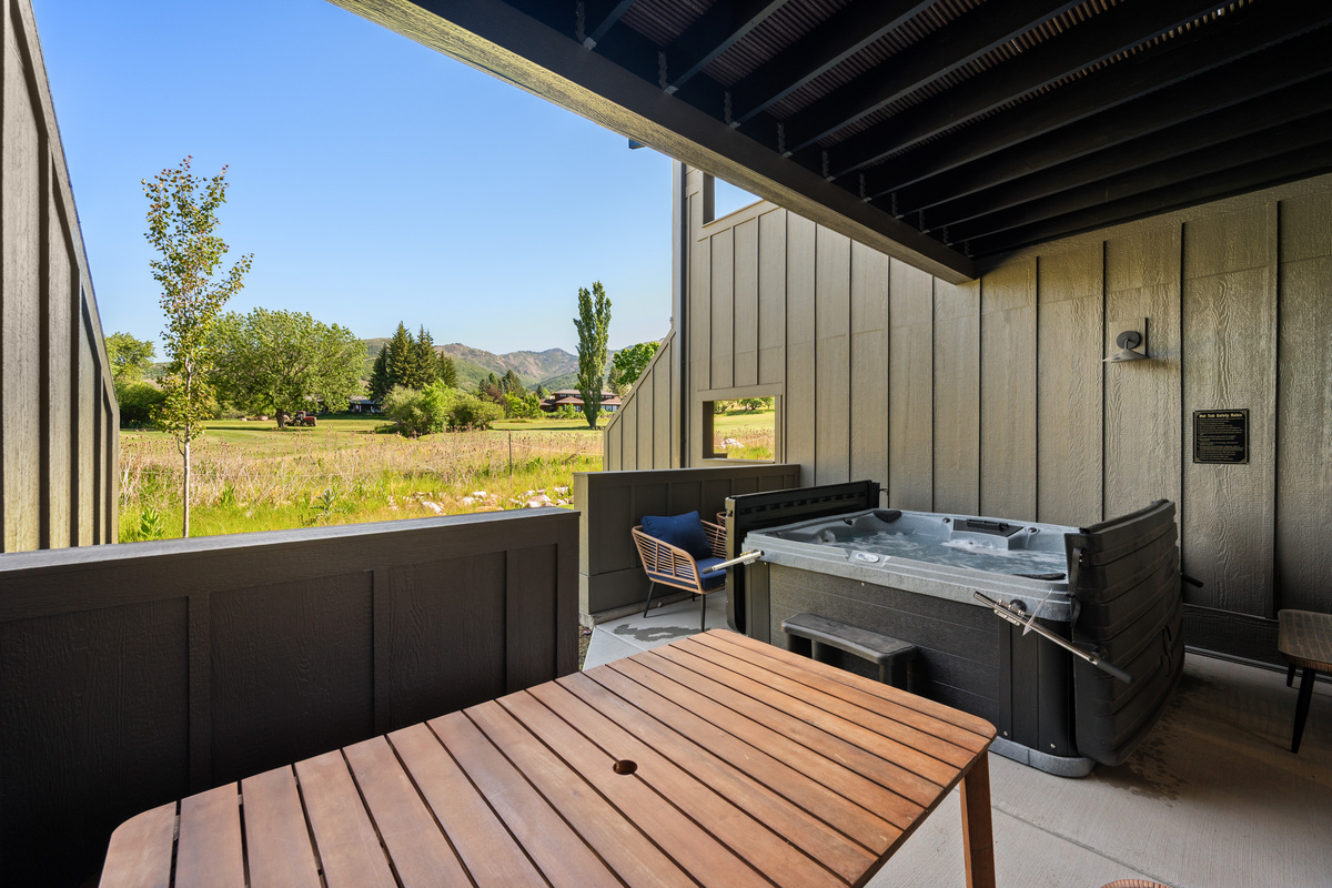 Gather around the patio table, soak in the hot tub, and enjoy the fresh mountain air in your private outdoor living space.