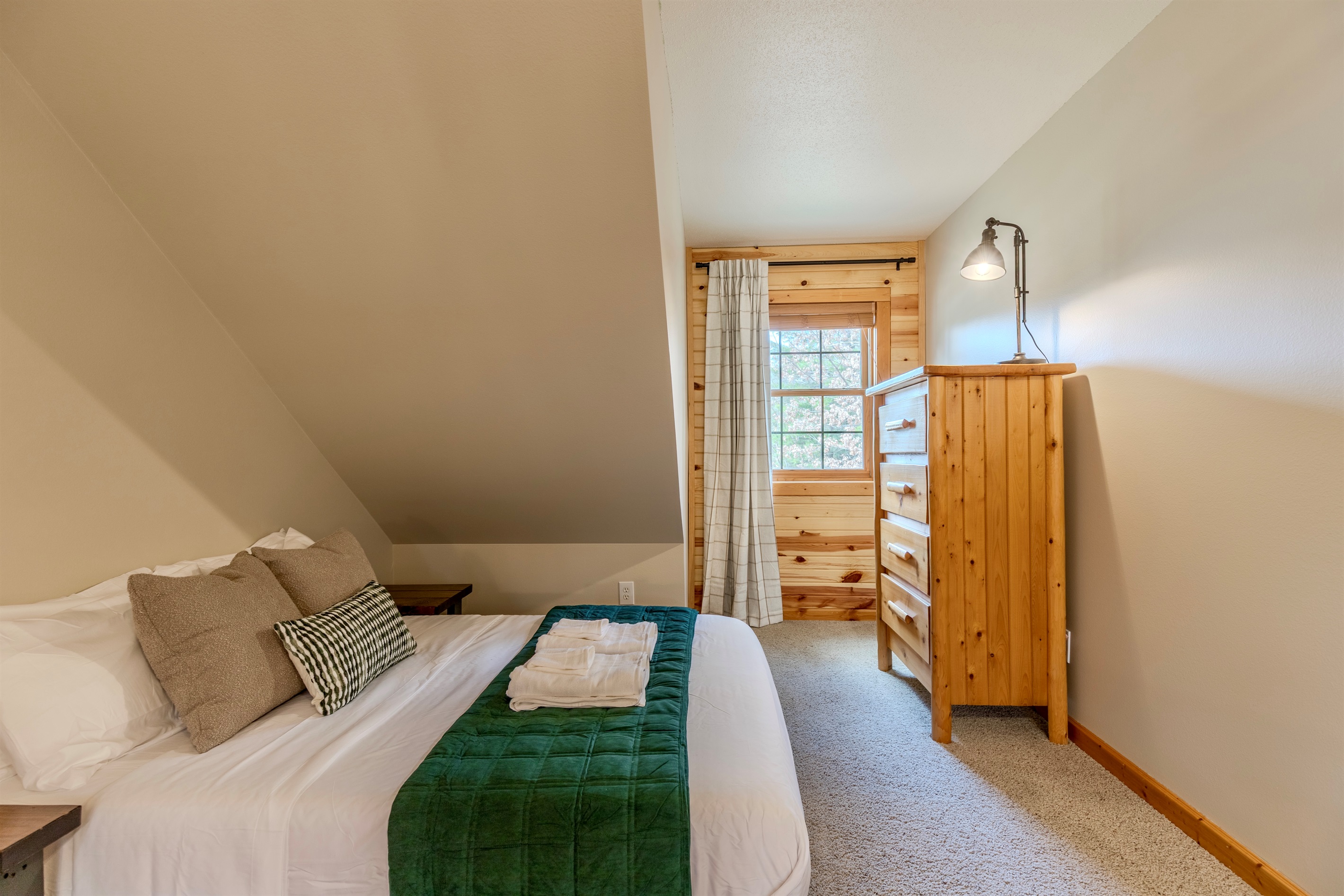 Upstairs bedroom with a queen & double bed.