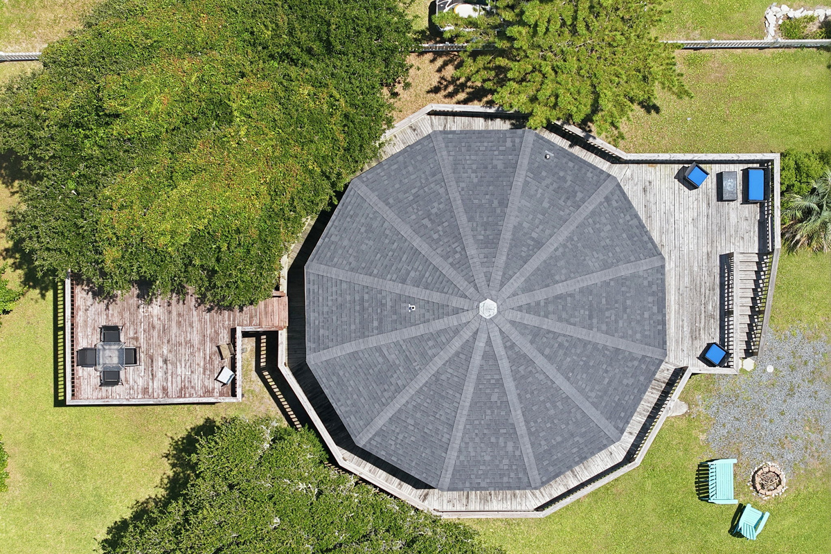 Overhead view highlighting the home's distinctive octagonal design, expansive wraparound deck, and private upper sun deck