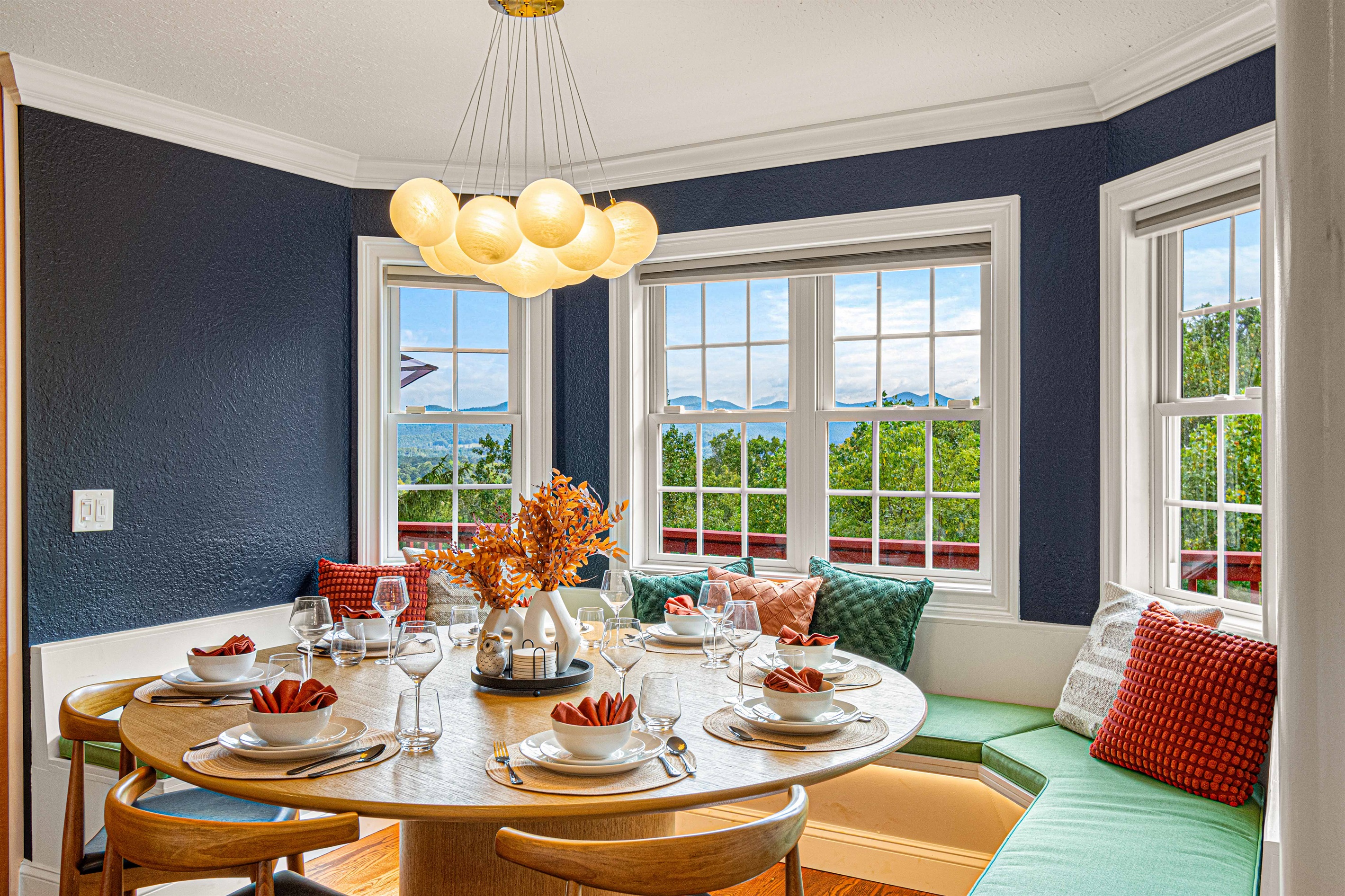 Gather around our spacious dining table for 10-12 and enjoy breathtaking mountain views with every meal! 🌄🍽️ Create lasting memories with family and friends in this stunning setting. Cheers