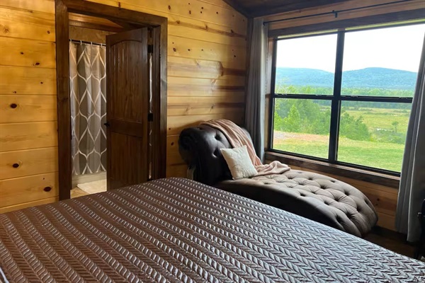Primary bedroom chaise lounge—relax and enjoy uninterrupted mountain and valley views.
