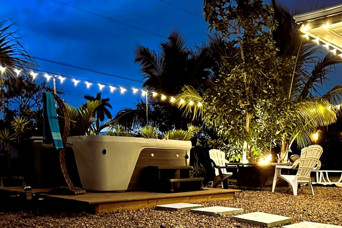 Epic Outdoor Living Space, with a Lush, Tropical landscape to transport you to a state of Relaxation, While enjoying all this paradise has to offer, featuring a spa and gas fire pit, with plenty of seating.