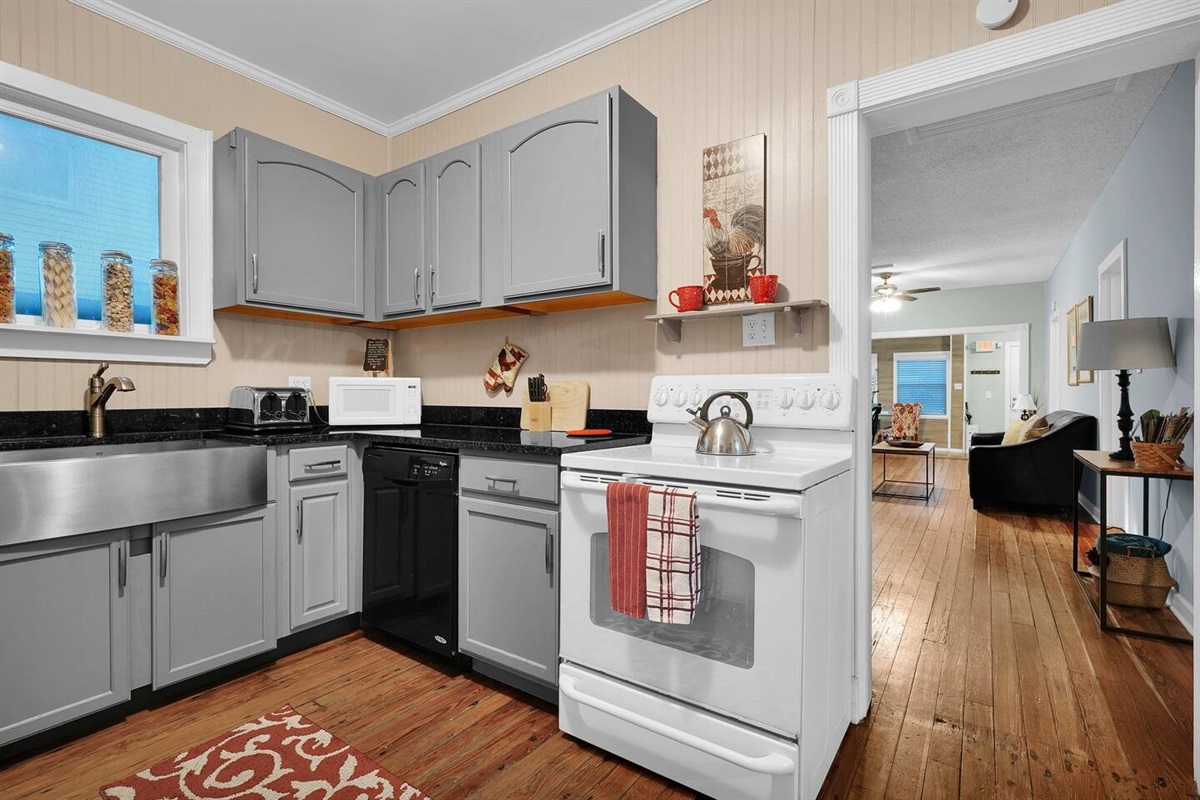 The kitchen connects right into the living room and dining area making the whole house connected. Enough space to cook for the group!