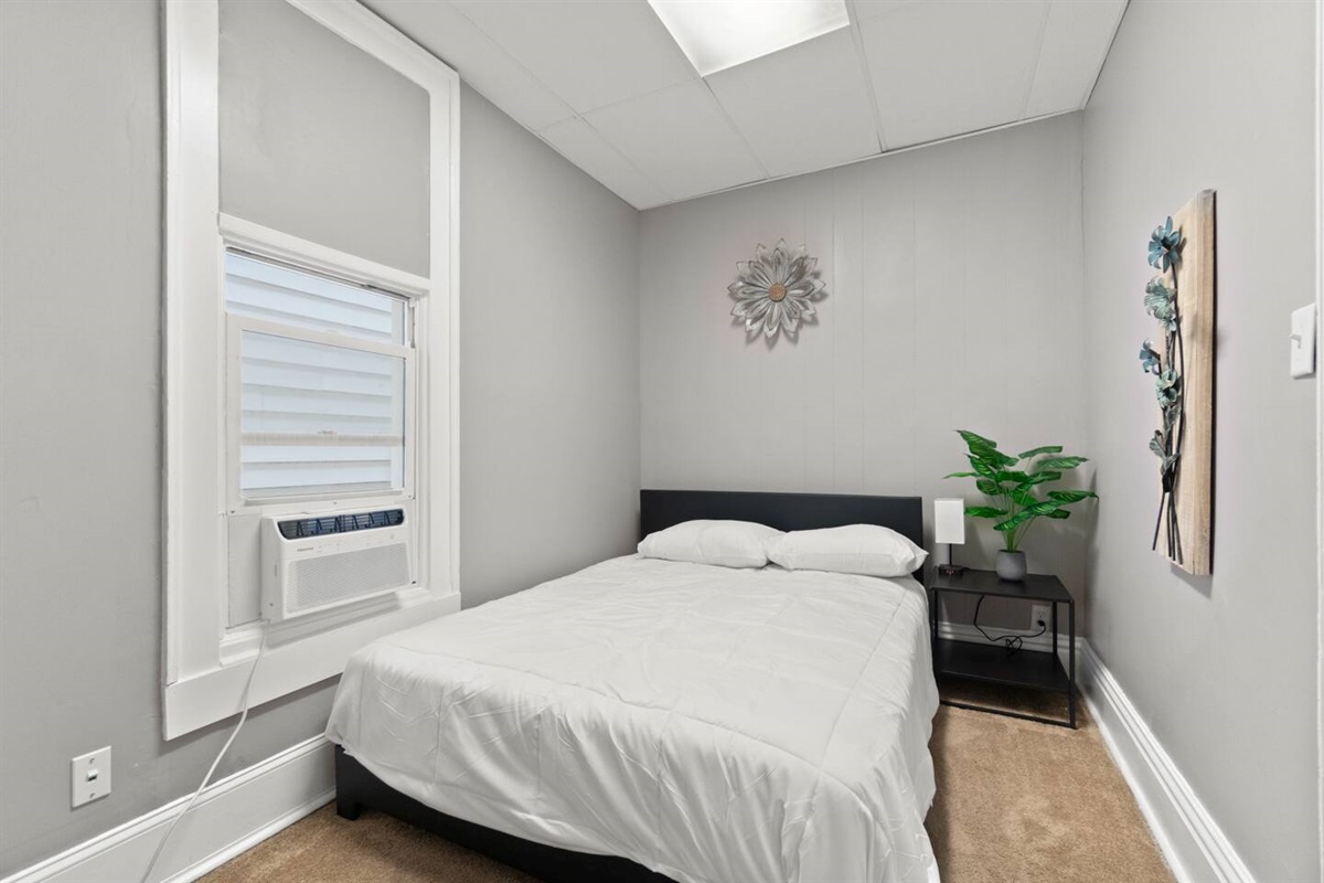 The bedroom features a plush queen-sized bed for ultimate comfort and relaxation.
