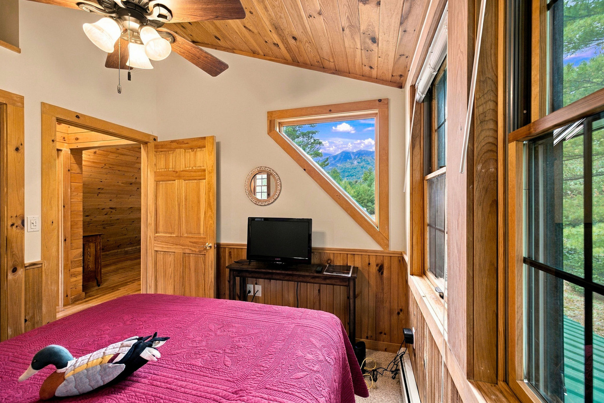 Wake up to a beautiful view of Whiteface Mountain from this inviting bedroom.