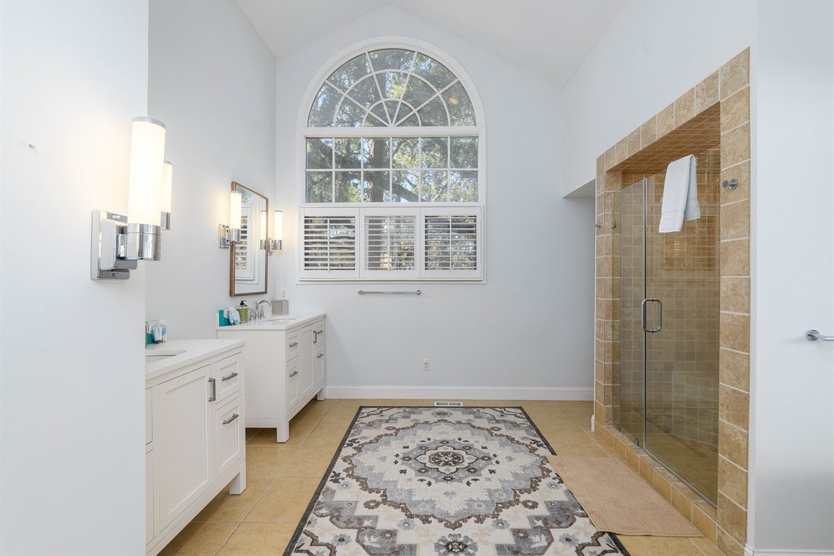 Master bath features dual sinks, walk in shower