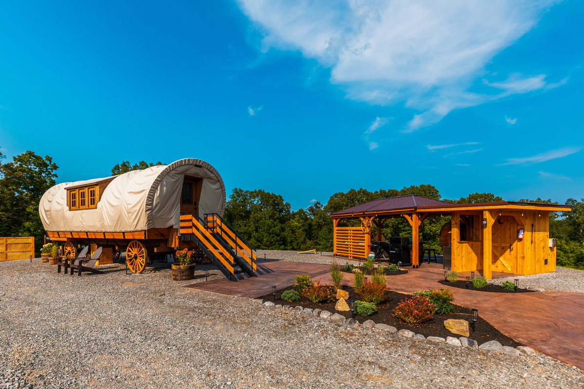 A unique luxury wagon retreat with private outdoor living, spa amenities, and beautiful open space.