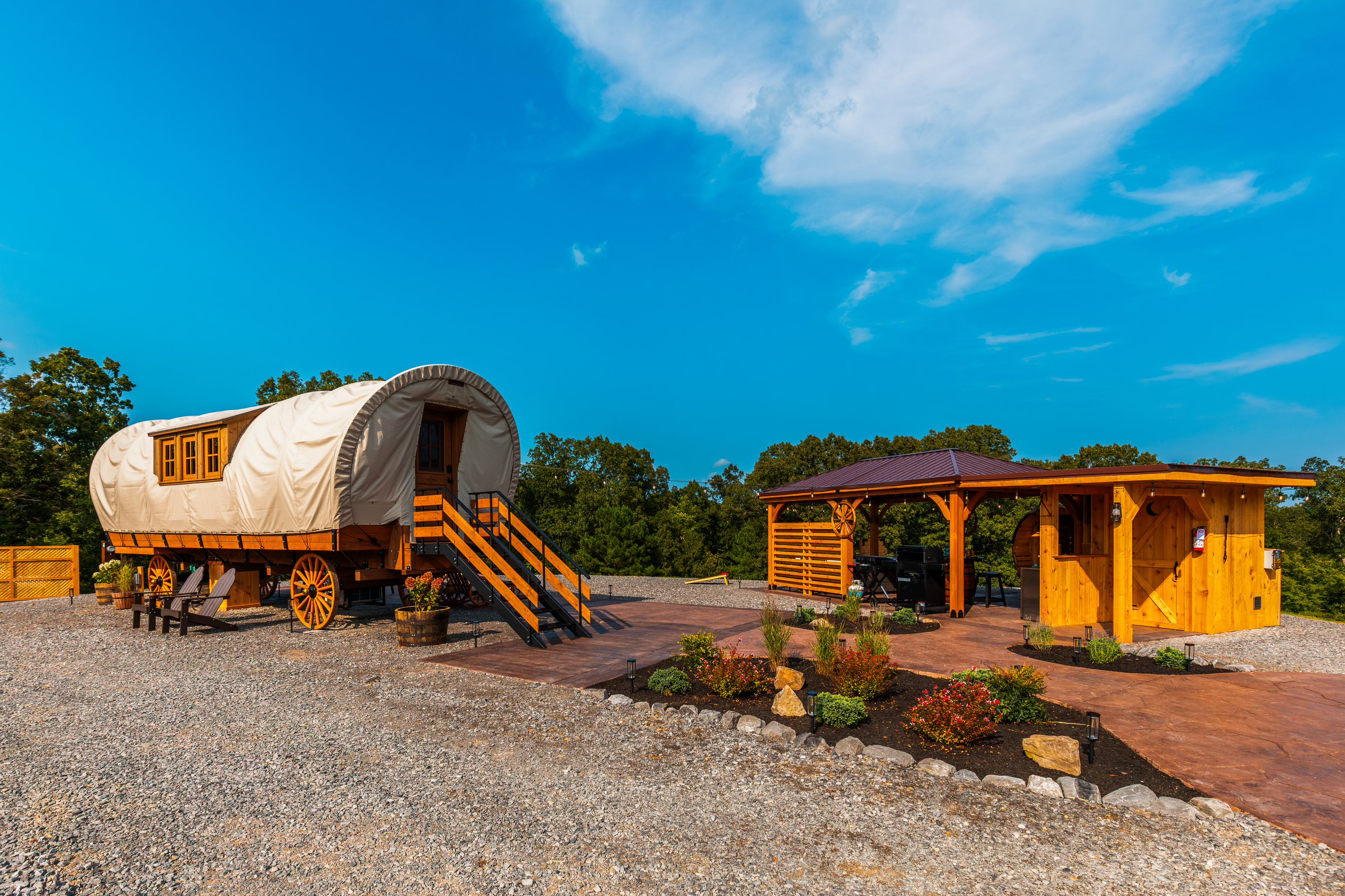 A unique luxury wagon retreat with private outdoor living, spa amenities, and beautiful open space.