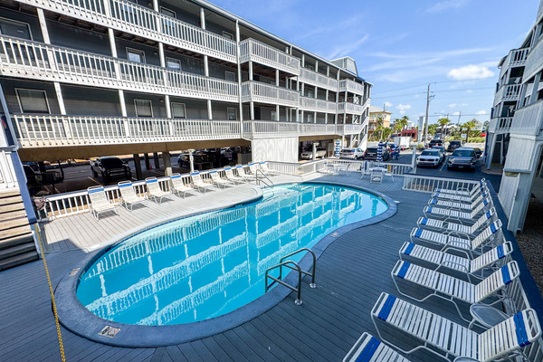 Elevated view of the pool deck with plenty of loungers