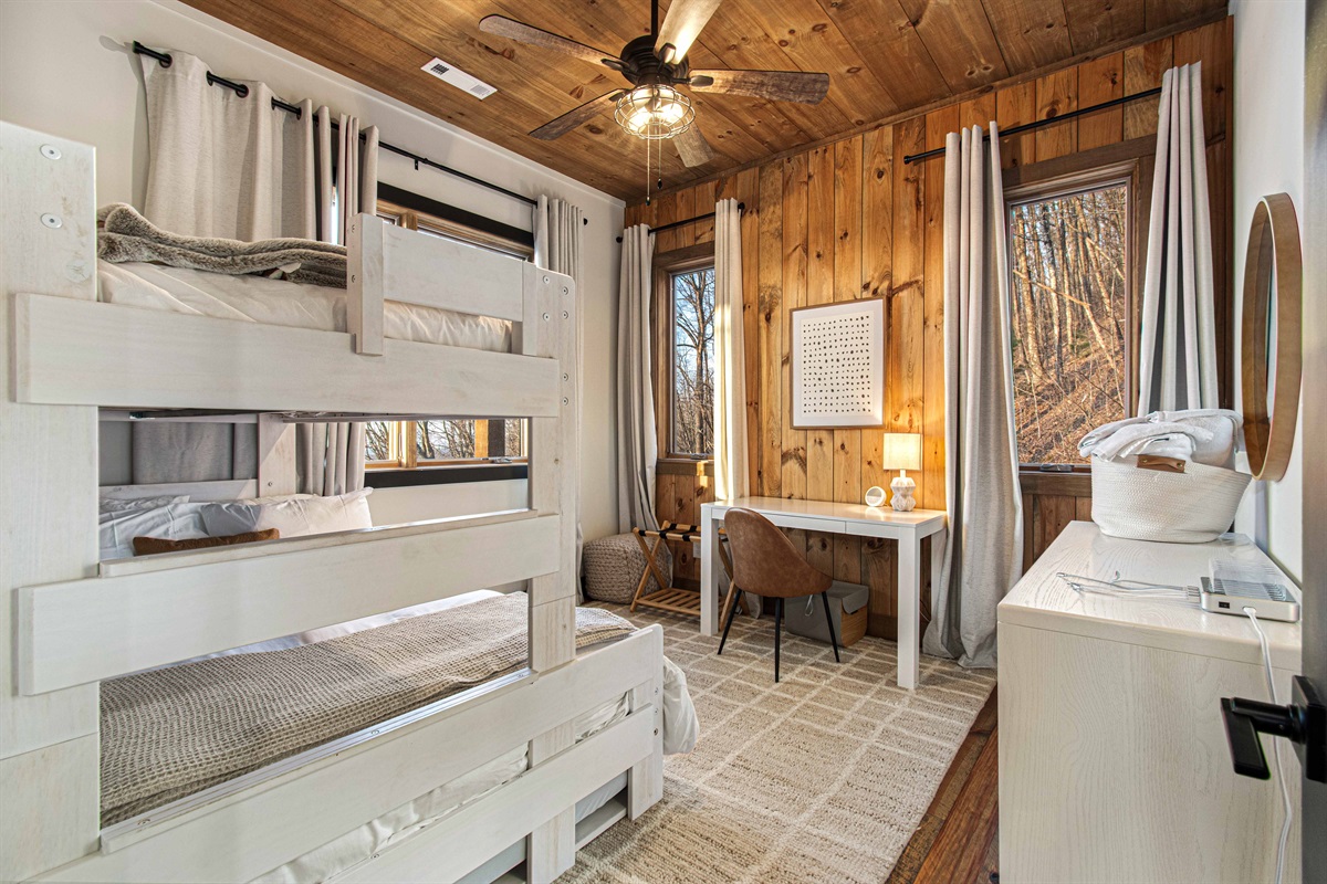 Work desk and a full dresser in the bunk room