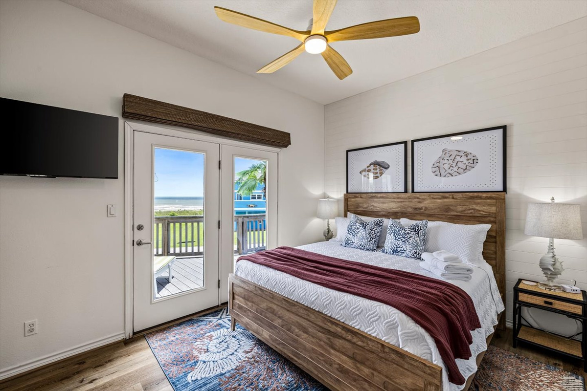 The Shell primary suite on the main level has access to the deck, and views for miles of the Gulf. The roller shades are remote controlled and black out for privacy. 