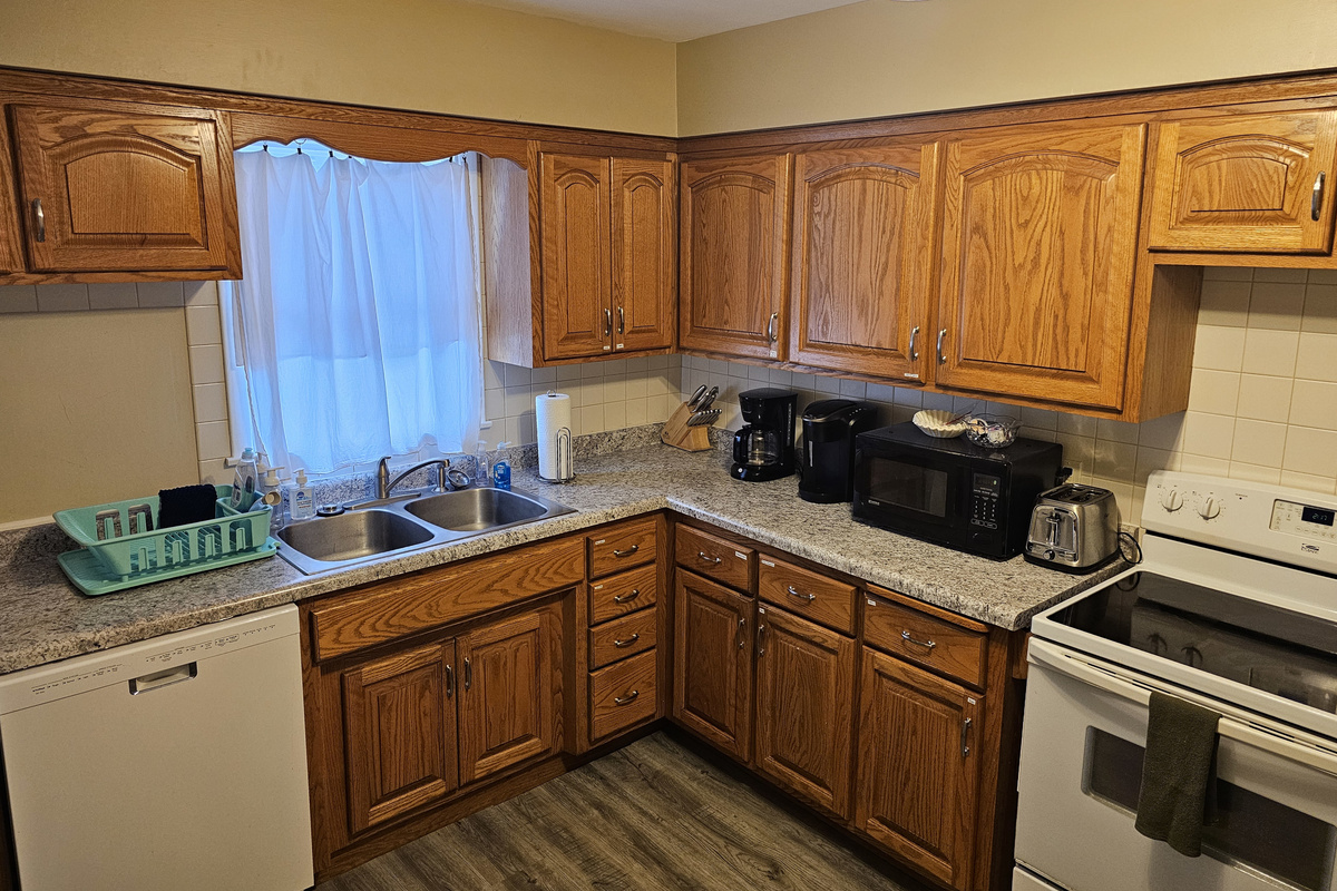 Full kitchen with stove, refrigerator, dish washer, microwave, coffee makers, pots/pans, and most other essentials.