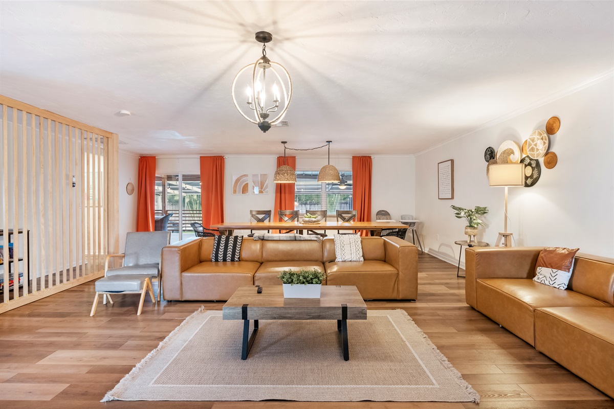 Newly decorated! Huge boho themed living room with 12-foot long custom dining table.