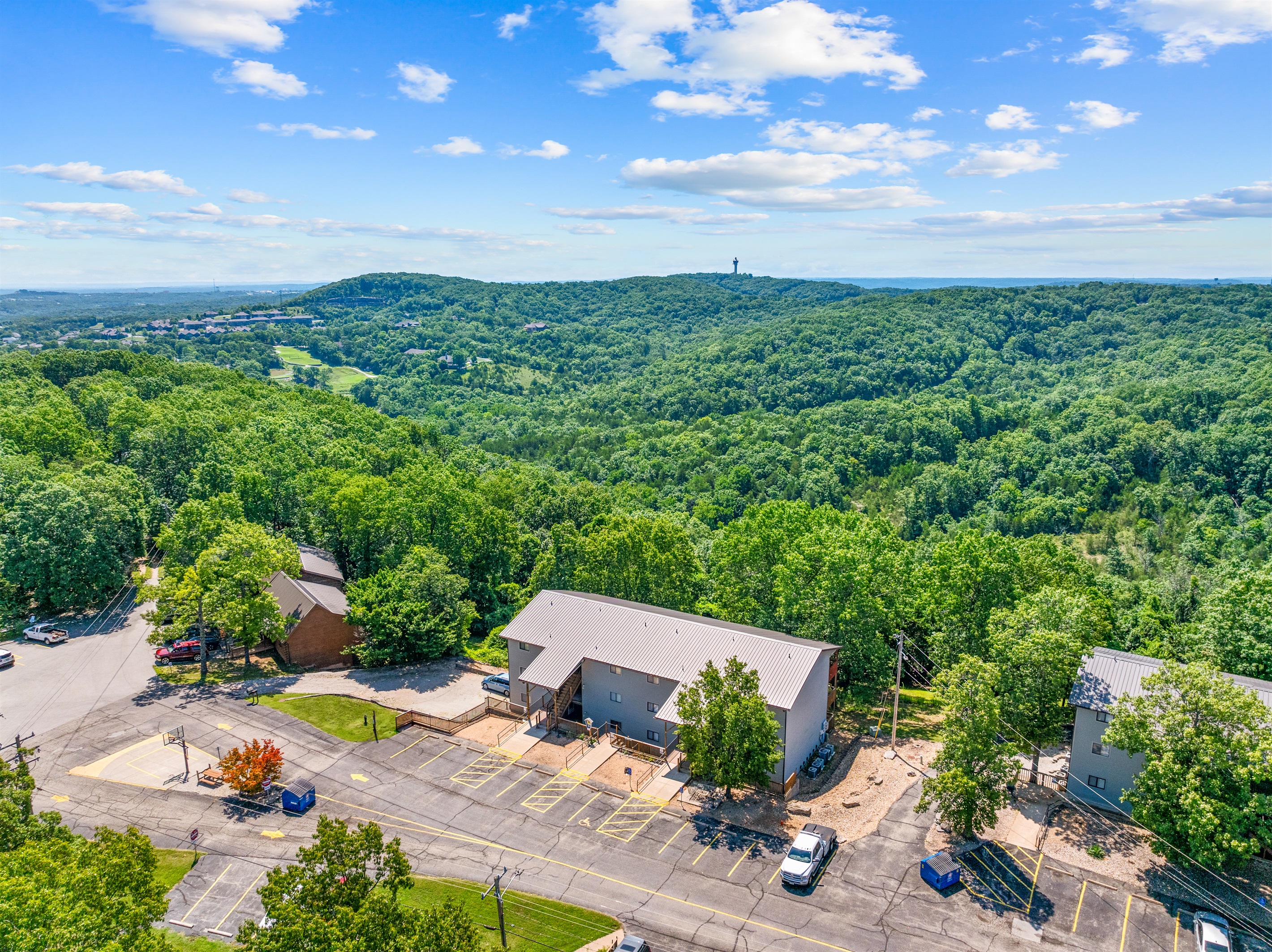 Perched above the trees, this quiet hilltop condo puts Ozark views front and center.