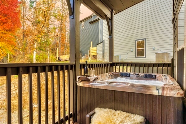 Relax in the brand new hot tub with soothing waterfall feature after a long day of exploring! Nestled on the covered deck, it offers warm jets and a tranquil ambiance surrounded by beautiful autumn foliage. The perfect way to unwind and recharge.