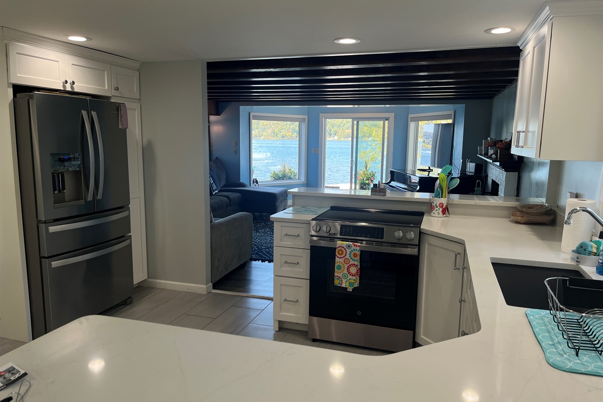 Kitchen into the living room with lake views