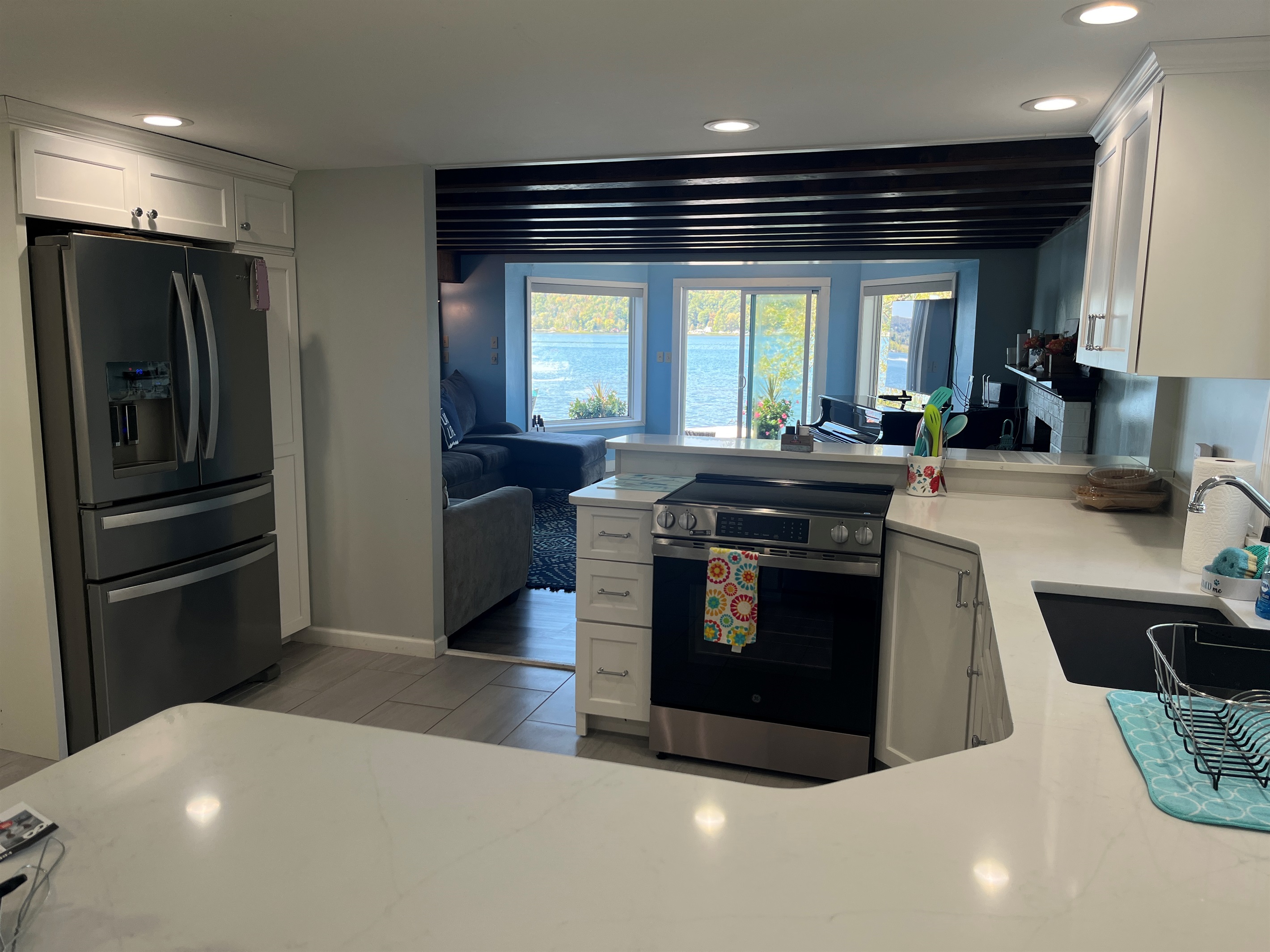 Kitchen into the living room with lake views