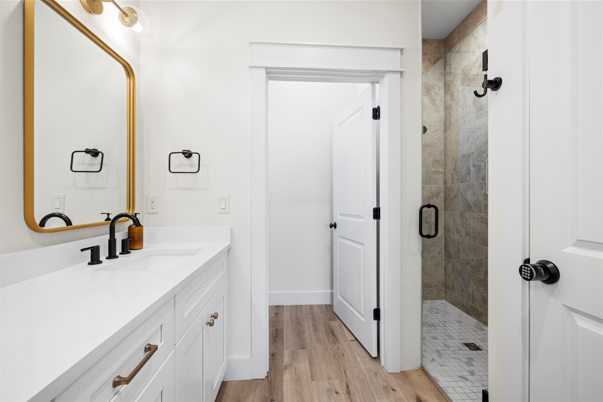 1st Floor Bathroom 2 has a double vanity, separate water closet and custom walk in shower
