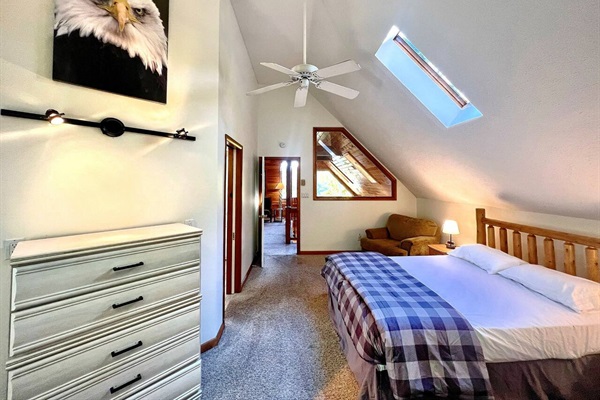 Tons of natural light comes through in the primary bedroom skylight and arching windows.