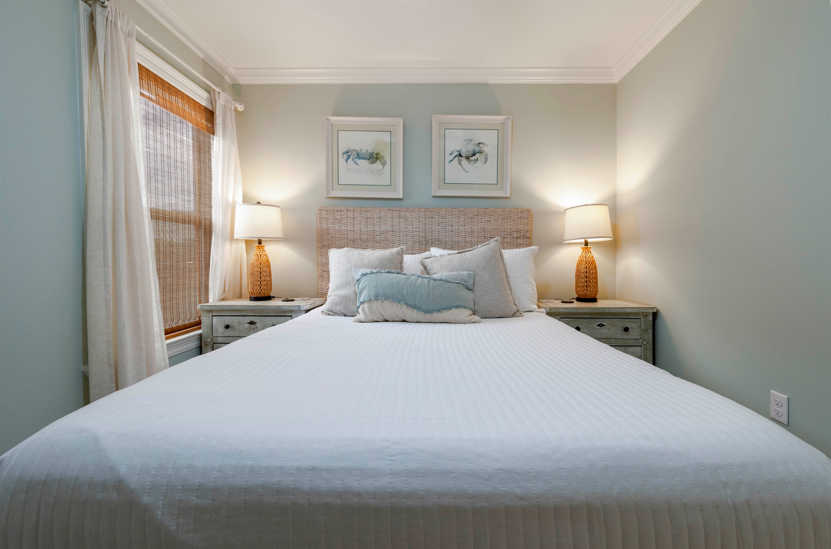 Relax in a cozy bedroom with a large bed, soft pillows, warm bedside lighting, and a peaceful atmosphere.
