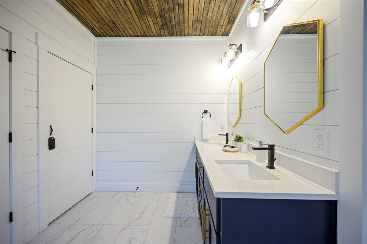 Modern double vanity with upscale fixtures and thoughtful details.