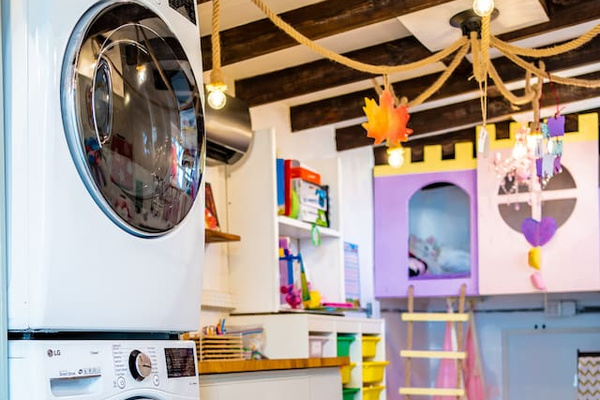 This is the laundry/playroom. If you have kids(especially little girls), you will LOVE this room! Our girls go into here for hours! There is a swing chair, play kitchen, books, crafts, upper loft, slide. You are free to relax in the pool:)