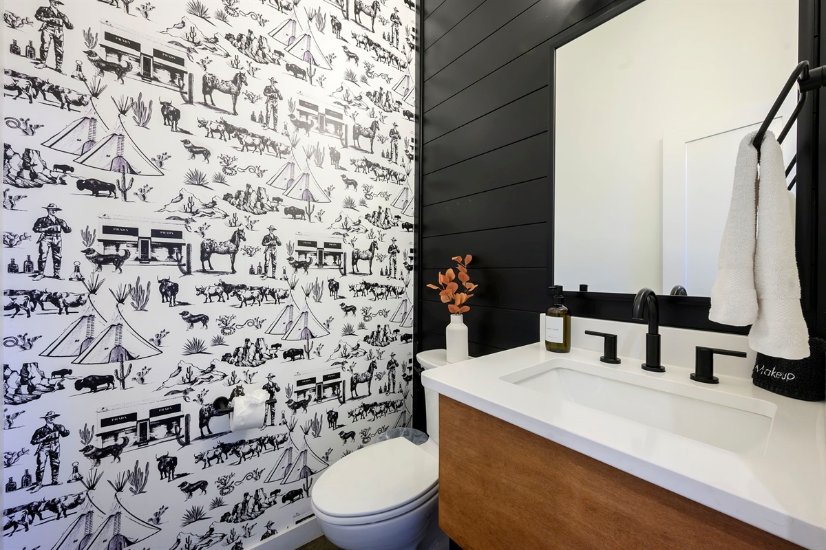 Half bathroom with chic modern design. Conveniently located near the main living area. 