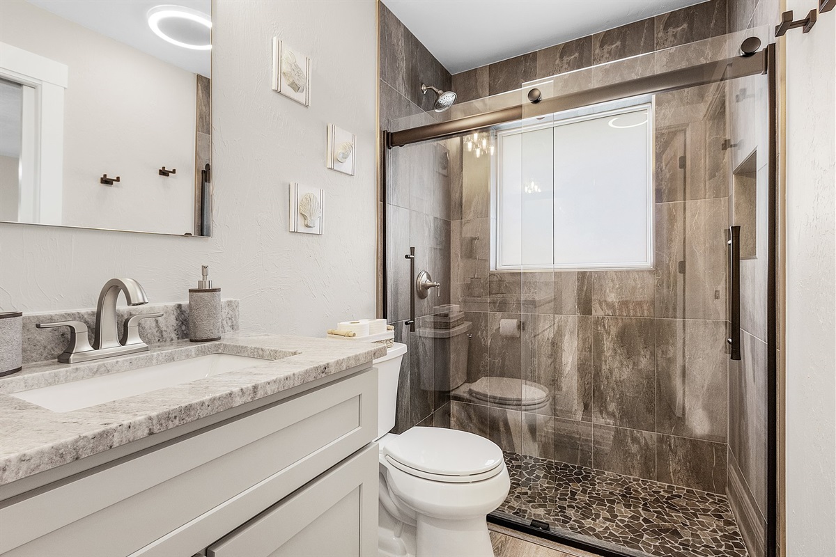 Hello Primary Bath!  Yes Please!   Beautiful walk-in tiled shower and a large walk-in closet!