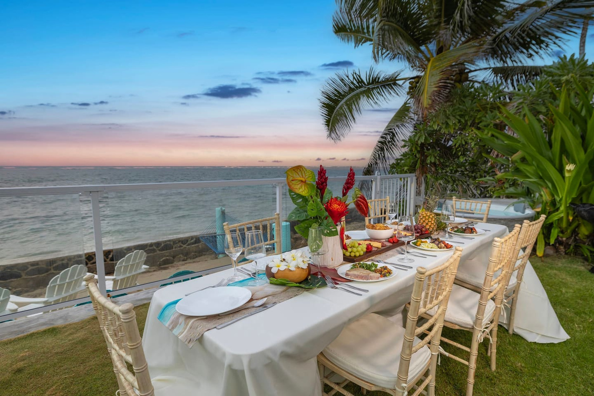 Beachfront dining in home's huge beachfront garden with a 15-person beachfront gazebo, beachfront gym and ethereal lily flower plants
