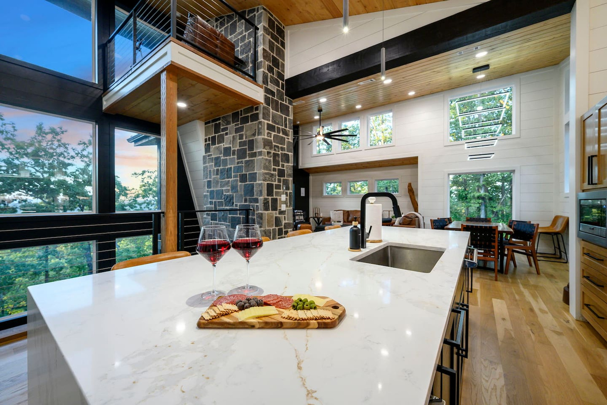 Spacious luxury kitchen with modern finishes, plenty of prep space, and beautiful mountain views.
