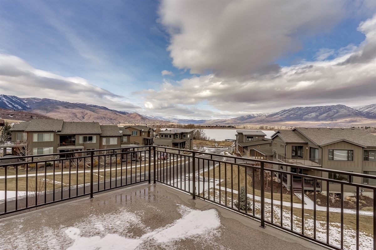 Private balcony off the primary suite overlooking Pineview Reservoir