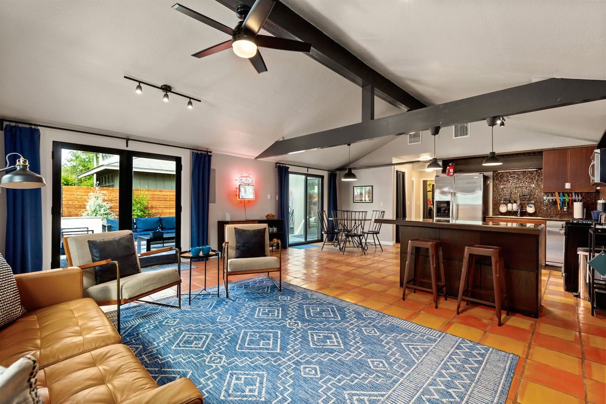 Living area: Love seat, couch, and 50 inch Smart TV with DVD player