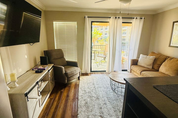 Living room with Smart TV and balcony doors