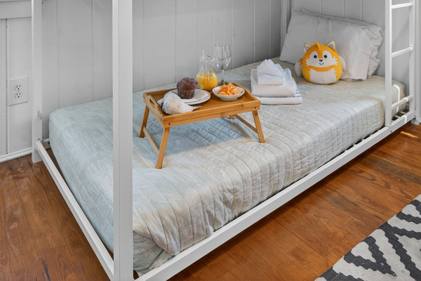 Cozy secondary sleeping space featuring twin bunk beds and efficient layout.