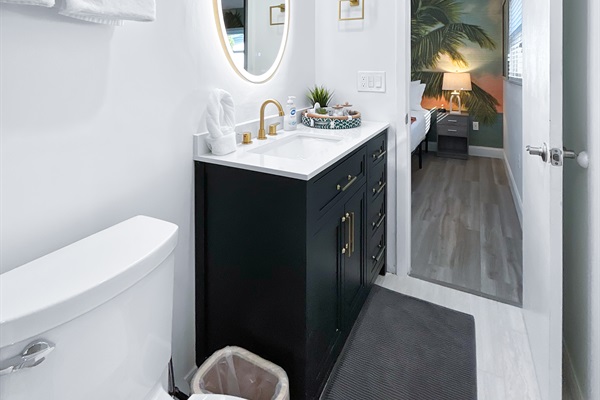 ✨ En suite bath with modern vanity + luxe lighting