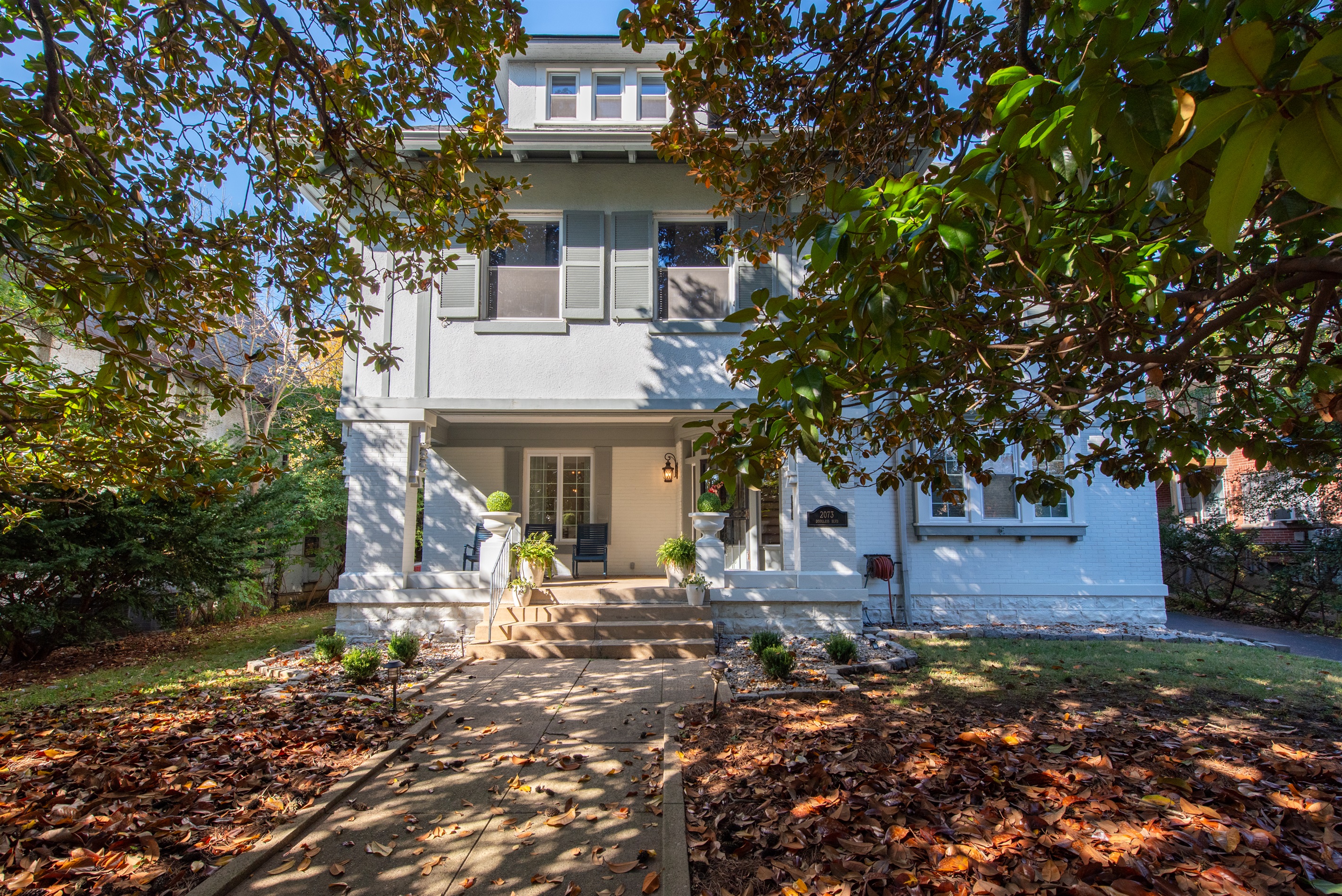 Classic home on 1/2-acre in Louisville Highlands, KY Bourbon Trail. Shaded by magnolia trees, with a large porch for sipping bourbon, parking for 12 cars—ideal for explorers!
