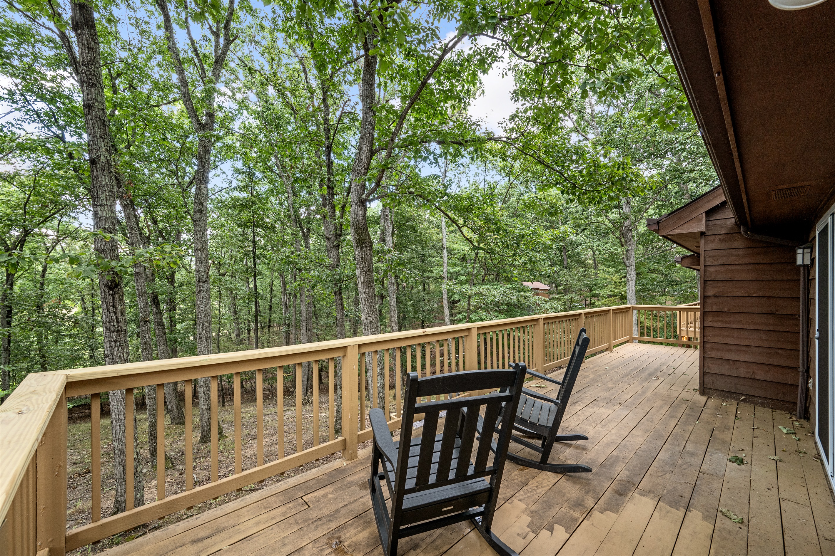 The sliding glass door in the master bedroom leads straight out onto this deck, where time seems to move slower.  