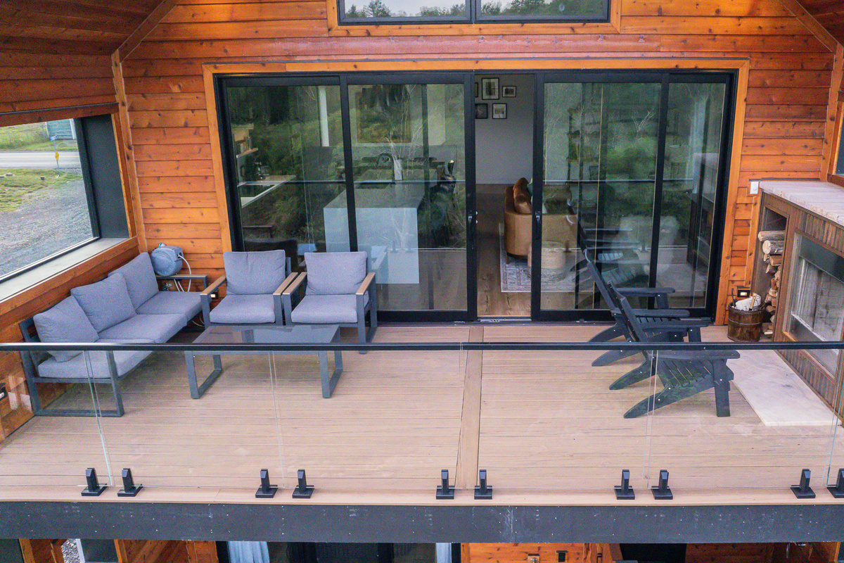 Great Room Porch with stocked outside fireplace