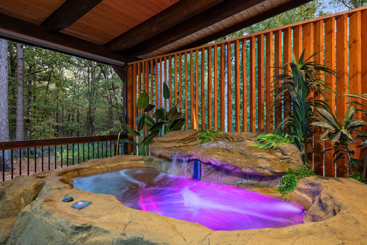Relax in the private hot tub tucked beneath a cozy covered deck.