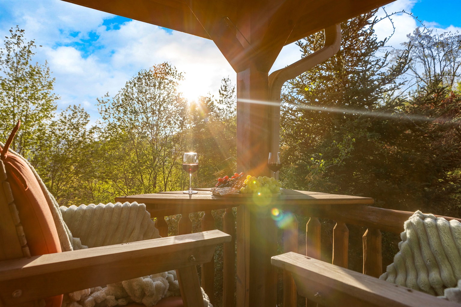 Balcony Retreat: Sip wine under the sun, surrounded by lush views and delightful treats!