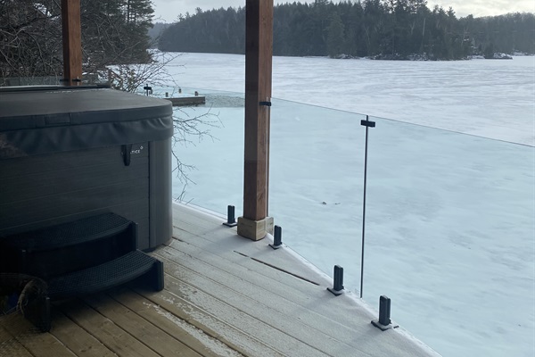 Lower balcony and hot tub directly accessible from cottage main floor