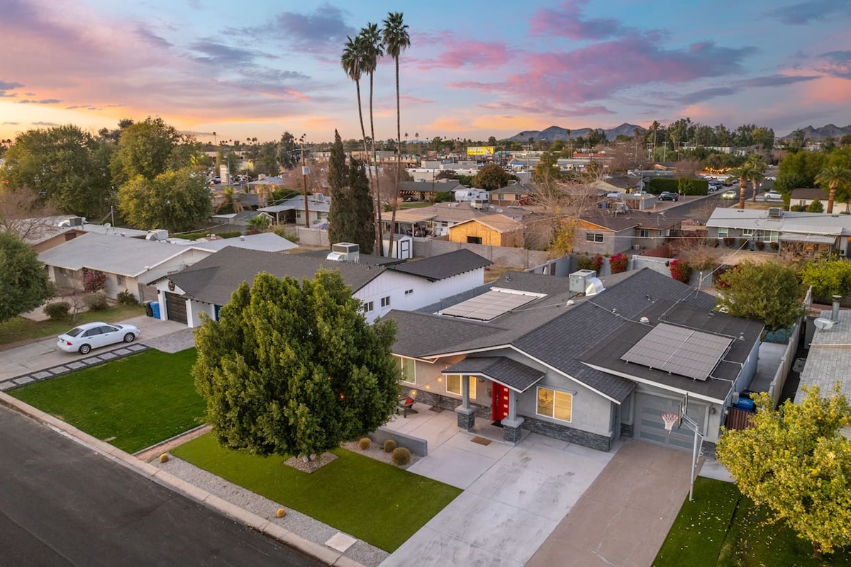 Aerial view of the house, capturing its full layout and surrounding landscape for a comprehensive perspective.