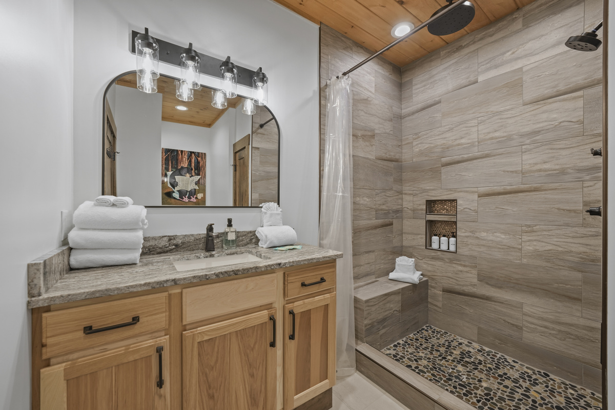 1st Floor Master King Suite –Enjoy the luxurious spa-style shower with a rain, hand & full shower head for the perfect start or end to your day. Plush towels & premium shampoo, conditioner & body wash are provided for a relaxing, hotel-style experience