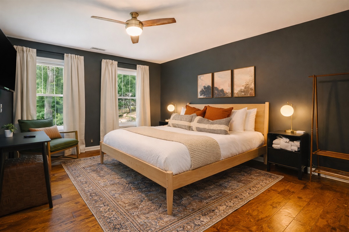 Spacious king retreat with calming tones — the perfect place to recharge in comfort.