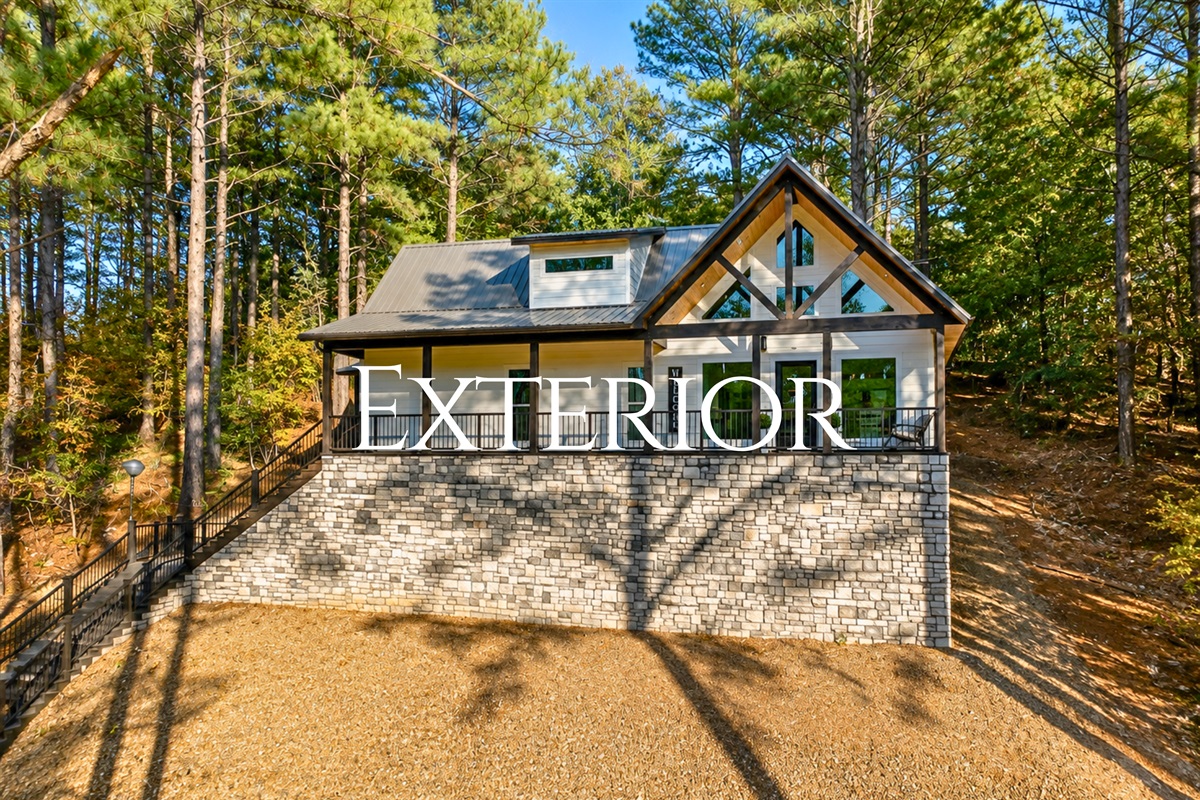 Surrounded by towering trees and peaceful nature, this modern cabin retreat was designed for unforgettable couples getaways in Broken Bow.