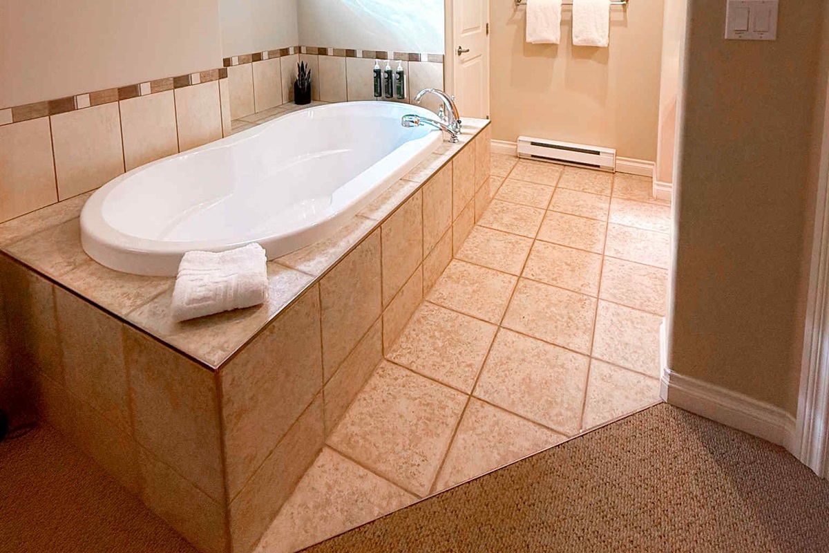 Unit A Soaker tub right in primary suite.