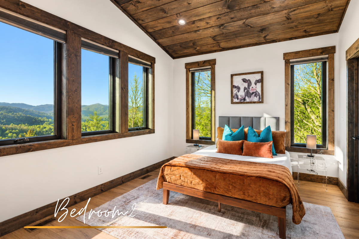 Queen bed wrapped in calm tones.