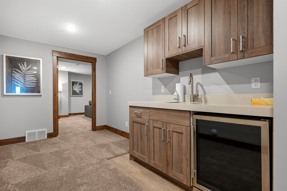 Enjoy a snack in the kitchenette located in the lower level living area, complete with snack bar, sink, mini-fridge and popcorn maker.