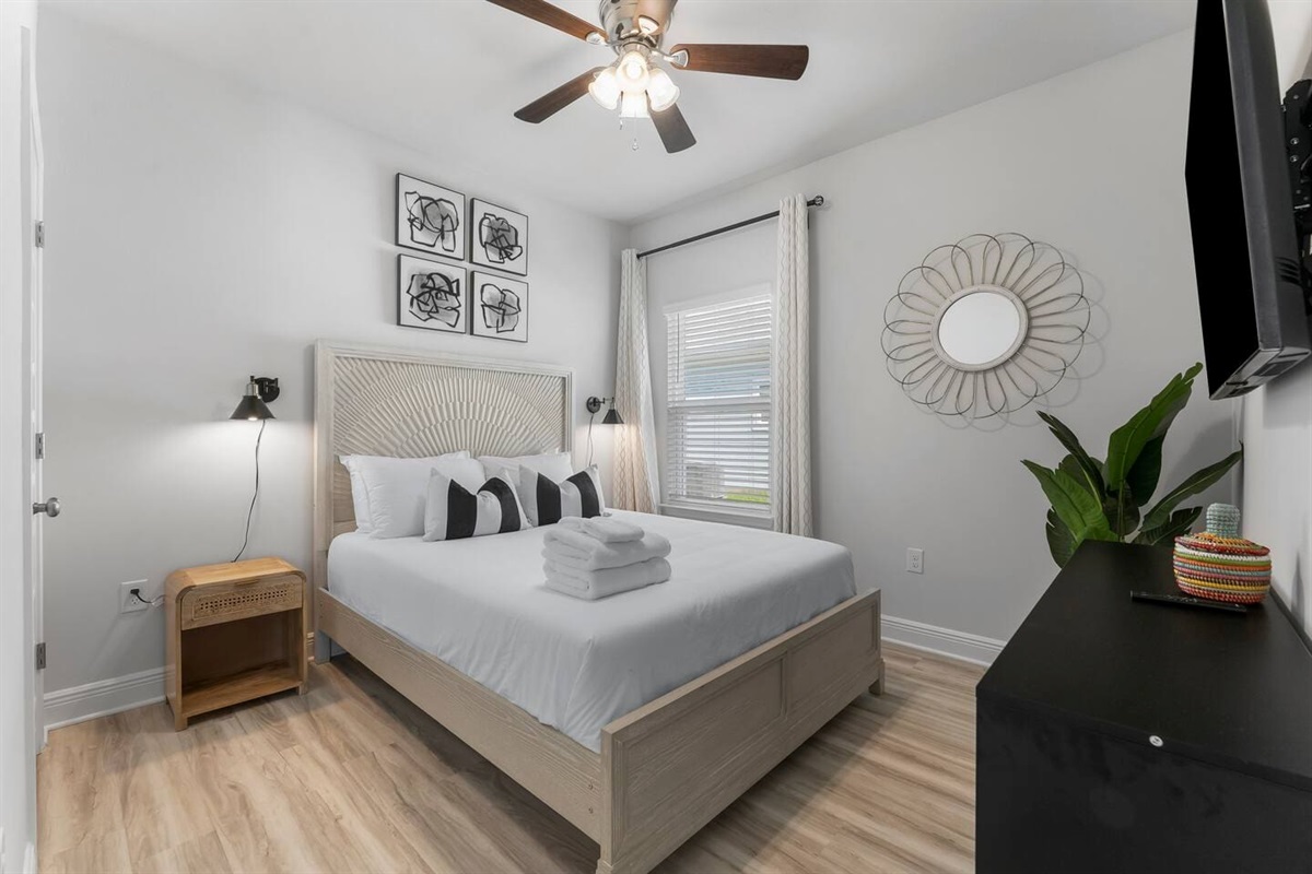 Comfort meets convenience in this bedroom with ample natural light and modern amenities.