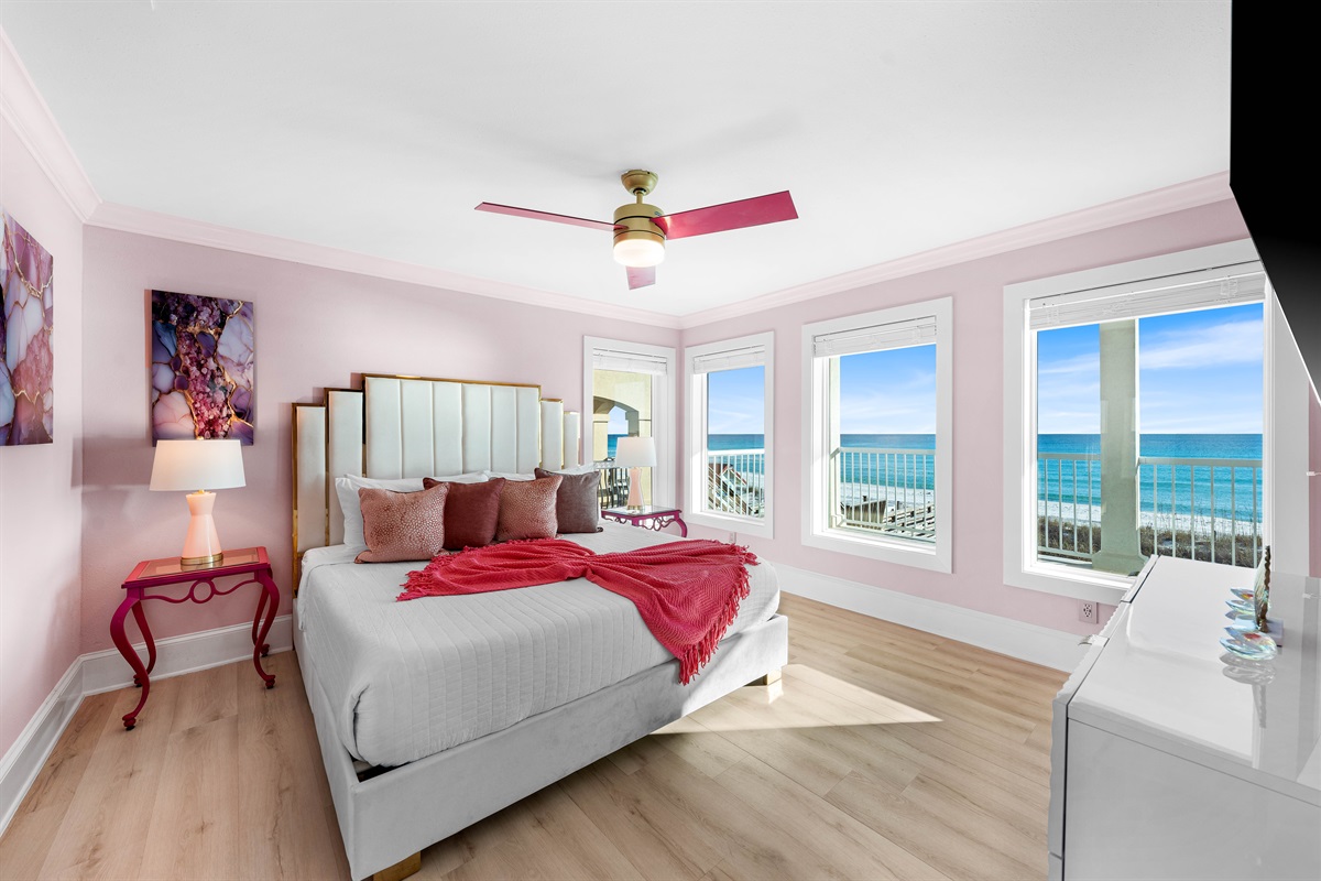 Beachfront Views & King Comfort: Relax with a 65" Smart TV and a newly remodeled ensuite bathroom featuring a soaker tub and separate walk-in shower. This first-floor suite offers easy access to the private pool and beach.